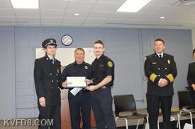 FF Austin Tracey on the left accepting his certificate from Training Coordinator Fink and his Brother Jackson Tracey who is a member of CFD